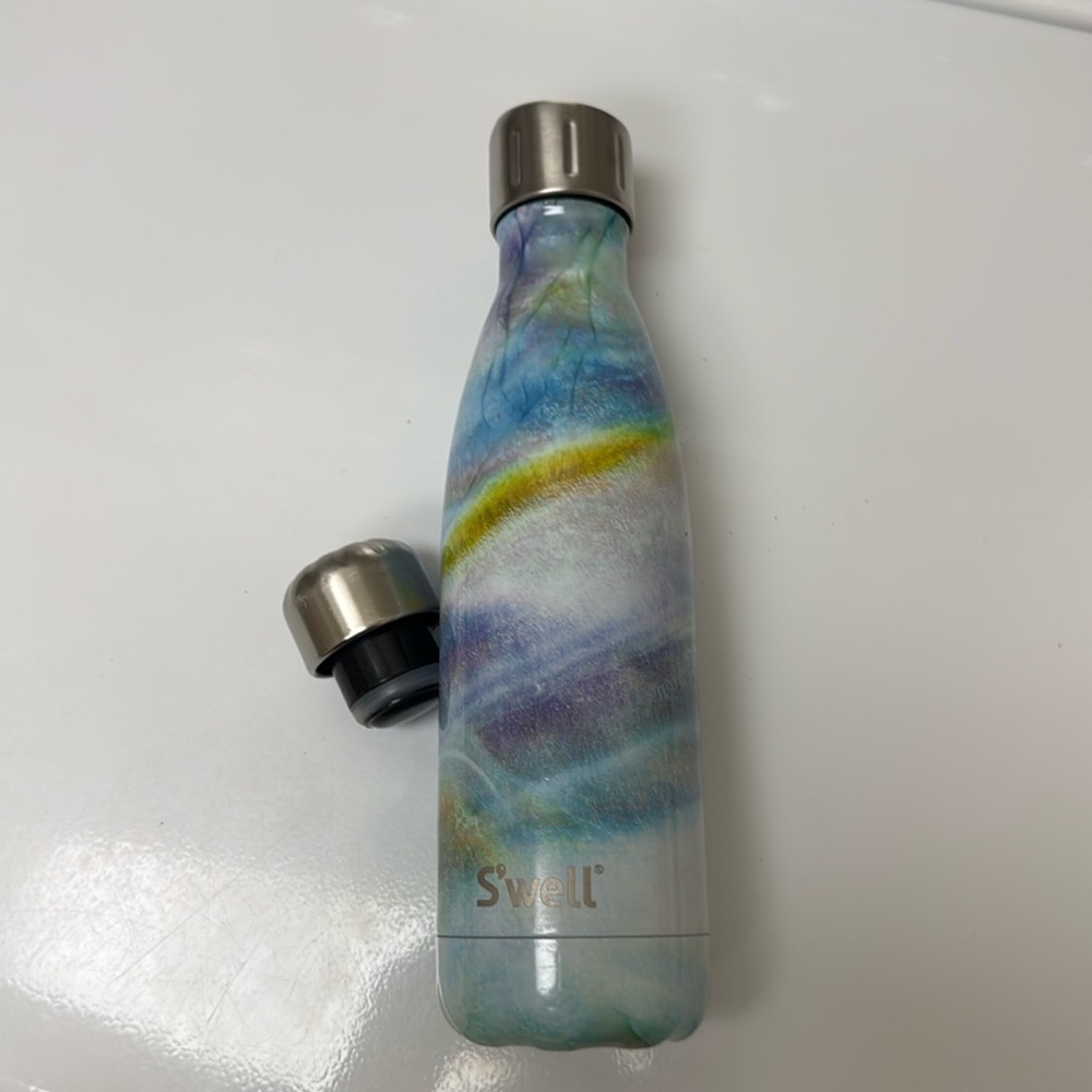 Swell bottle with two lids. Great shape.